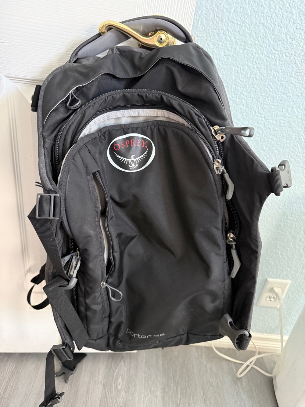 OSPREY Black Porter travel backpack with gray accents